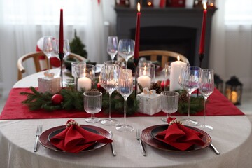 Festive table setting with Christmas decor indoors, closeup