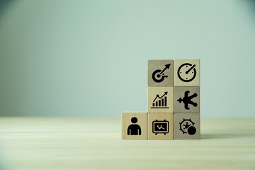 Wooden blocks with business icons representing growth and strategy