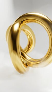 Seamlessly looping slow rotation of three minimalist, interlocking golden torus rings floating in a weightless, fog-filled white studio space expensive, interlocking, design