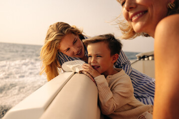 Family enjoying special moments on a boat ride together in the ocean