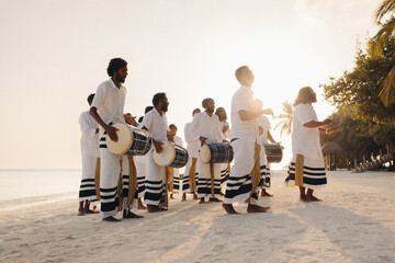 Traditional Maldivian drumming performance at a tropical resort beach
