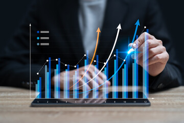 Business Growth Graph 2026 Concept, Businesswoman Using a Tablet to Compare Financial and Business Growth Charts, Forecasting Market Trends, Investment Performance, Next-Year Business Outcomes
