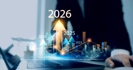 Businessman analyzing financial growth chart for 2026 year.Showing revenue increase, market trends, investment strategy, economic progress, success and future business development in 2026