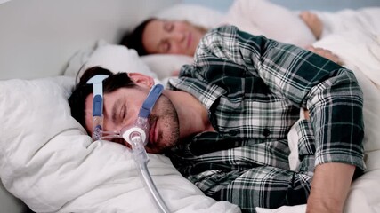 Man With Sleep Apnea Using CPAP Machine Catching Up