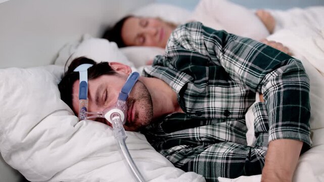 Man With Sleep Apnea Using CPAP Machine Catching Up