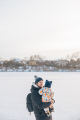 Father and child enjoying winter outdoors Copy Space