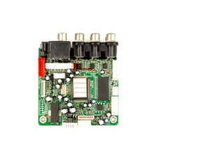 A close-up of a circuit board with microchips from an electrical appliance or computer on a white background. Concept of electronics and microchips.