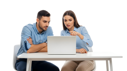 Two focused colleagues collaborate on a project, reviewing data on a laptop together