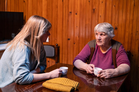 Women generations having tea and deep conversation