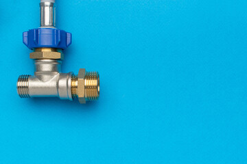 Metal Plumbing Pipe Fitting on Blue Background for Construction and DIY Projects