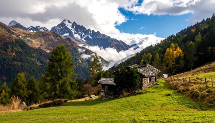 Idyllic Alpine landscape with traditional huts and snow-capped mountains.