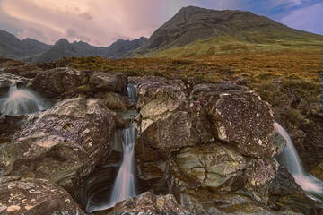 Allt Coir a' Mhadaidh stream cascading at Fairy Pools series of falls, Sgùrr an Fheadain and...