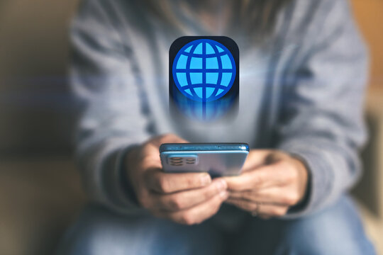 Exploring the World Wide Web A Woman Accesses Global Information Using Her Smartphone and Internet Browser