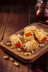 Fototapeta premium peanut candy bars with sweet filling on rustic wood, perfect for holiday treats