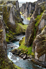 Iceland travel - Fja&eth;r&aacute;rglj&uacute;fur canyon and the river that flows between the high cliffs