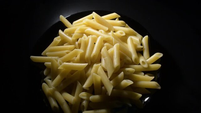 Just boiled macaronis turning in black plate