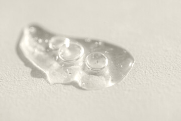 Extremely close-up view of a transparent gel with bubbles and colloidal gold. Cosmetic products. A...
