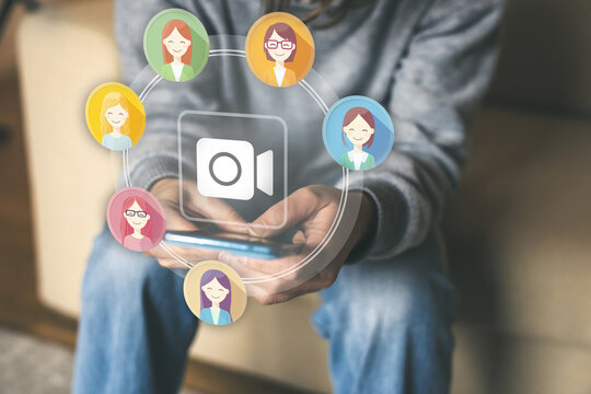 User Utilizing a Smartphone for a Virtual Video Conference Call Connecting with a Network of Diverse Online Female Participants