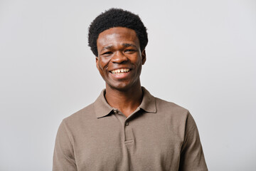 headshot of Young black man smiling in studio portrait © Cristina Garcia
