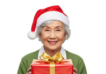 Smiling elderly asian woman in a santa hat holding a gift, isolated on transparent background