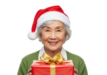 Smiling elderly asian woman in a santa hat holding a gift, isolated on transparent background