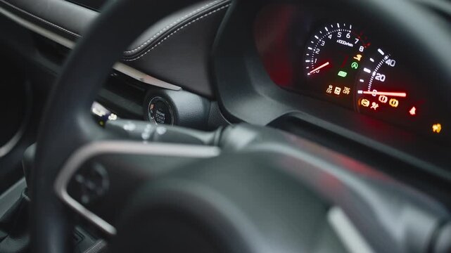 Close-up of a modern car start button being pressed, showcasing technology, convenience, and sleek design. Concept modern cars and comfort