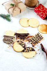 Christmas cookies dusted with chokolate and nuts.