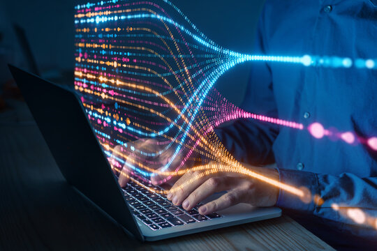 Programmer typing on laptop with colorful data flow visualization, concept of artificial intelligence, big data analysis, machine learning, and digital technology innovation - Powered by Adobe