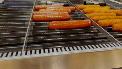 7-11 convenience store Hot dogs rotating on a grill