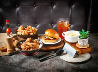 Indulge in a mouthwatering gourmet burger and crispy fried chicken feast perfect for casual dining promotions