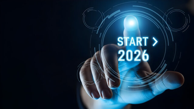 Finger pressing glowing futuristic button with start 2026 text for new beginnings