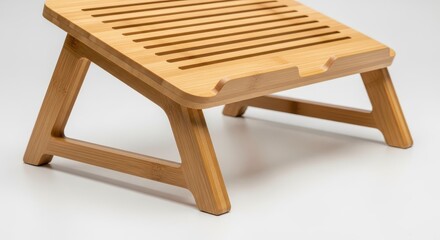 Slatted wooden surface stands elevated on folding supports against a light background