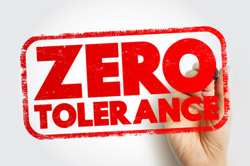 ZERO TOLERANCE stamp with rough texture and a hand holding a marker, ideal for safety rules, discipline policies, strict standards, and compliance-focused communication