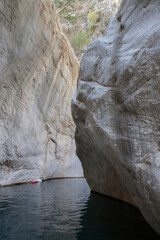 Stunning narrow Goynuk gorge with majesty of cliffs and turquoise waters. Dramatic rock formation towering over Goynuk canyon waters, Turkey.