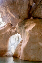 Stunning narrow Goynuk gorge with majesty of cliffs and turquoise waters. Dramatic rock formation towering over Goynuk canyon waters, Turkey.