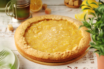 A tart with lemon marmalade served on the table	