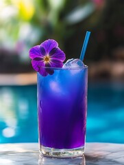 A refreshing drink in a glass with ice and a lavender flower for garnish.