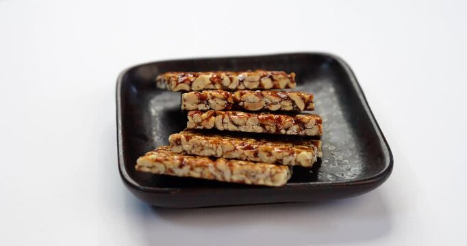 Peanut Jaggery chikki or bar using groundnut or shengdana with gur
