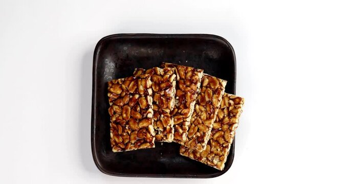 Peanut Jaggery chikki or bar using groundnut or shengdana with gur