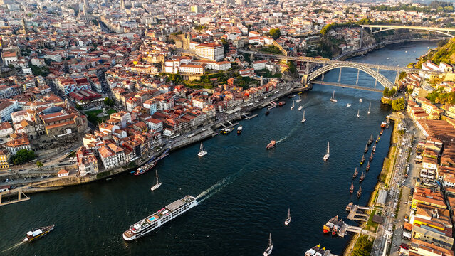 Sunset Drone View of Porto &ndash; Golden Hour Over the Douro River, Scenic Old Town, Cruise Ships, Riverside Architecture and Vibrant City Atmosphere. Portugal Aerial