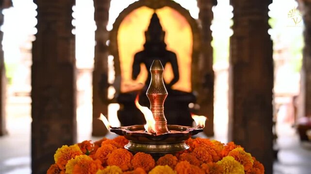 Lit Oil Lamp (Diya) Surrounded by Marigolds in a Hindu Temple for Matsya Jayanti Celebration