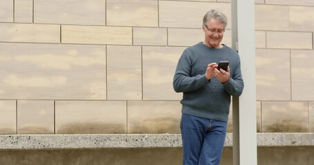 Retrieving phone, man tapping, scrolling while checking messages at pedestrian area, copy space