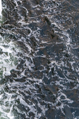 Abstract Close-up of Dark Water and White Foam