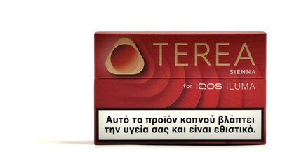 Naklejka premium Photo of a pack of TEREA tobacco sticks, the SIENA flavor-variant, isolated on white background. These sticks are designed for use with the IQOS ILUMA device.