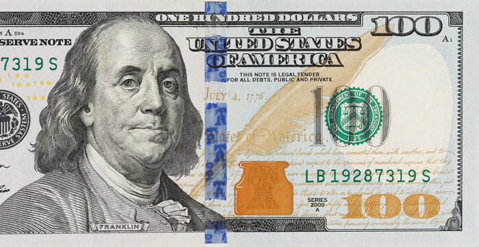 A picture of a part of a100 bill. It's the American money