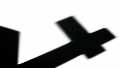 Fototapeta premium High contrast abstract geometric cross shadow on white