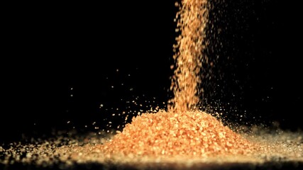 Cane sugar falls into a heap. Filmed on a high-speed camera at 1000 fps. High quality FullHD footage