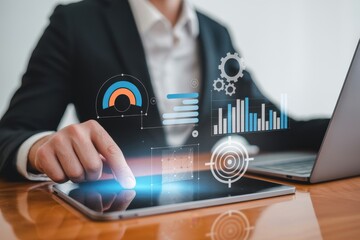 Businessman analyzing digital data on tablet, virtual charts display