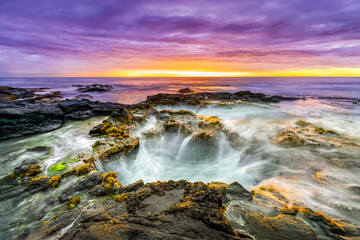 Pele&rsquo;s Well is a blow hole lava tube on the rocky beach  on the Big Island of Hawaii. One end is open to the sea and water rises, falls, and splashes with incoming waves of the Pacific Ocean.