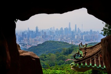 Guangzhou city skyline seen from Baiyun Mountain. Guangzhou cityscape in Guangdong, China.